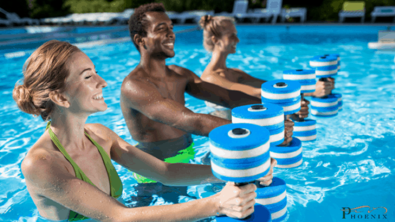 Picture of three people partaking in aquatic exercise.